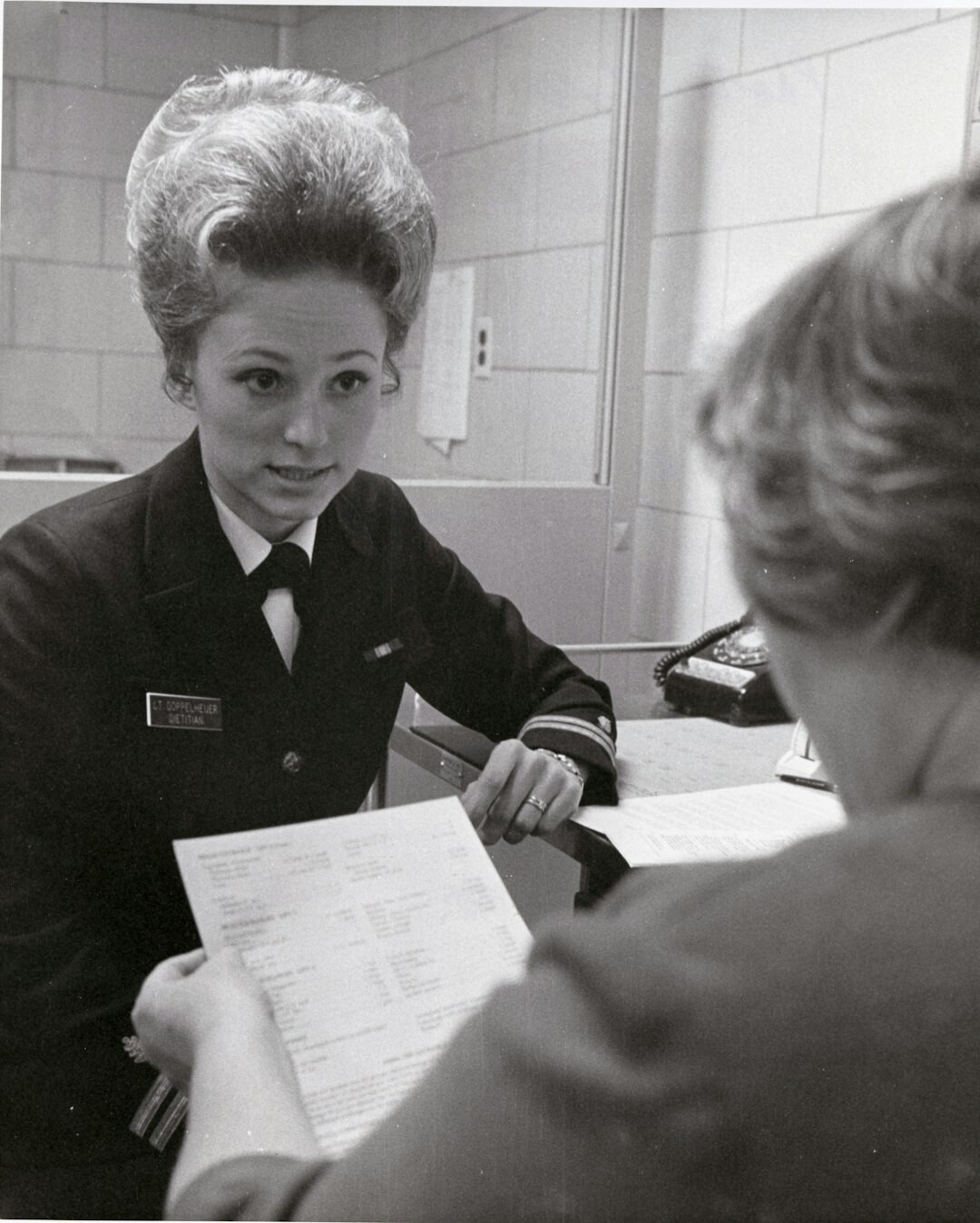 Editorial coordinator briefing a colleague